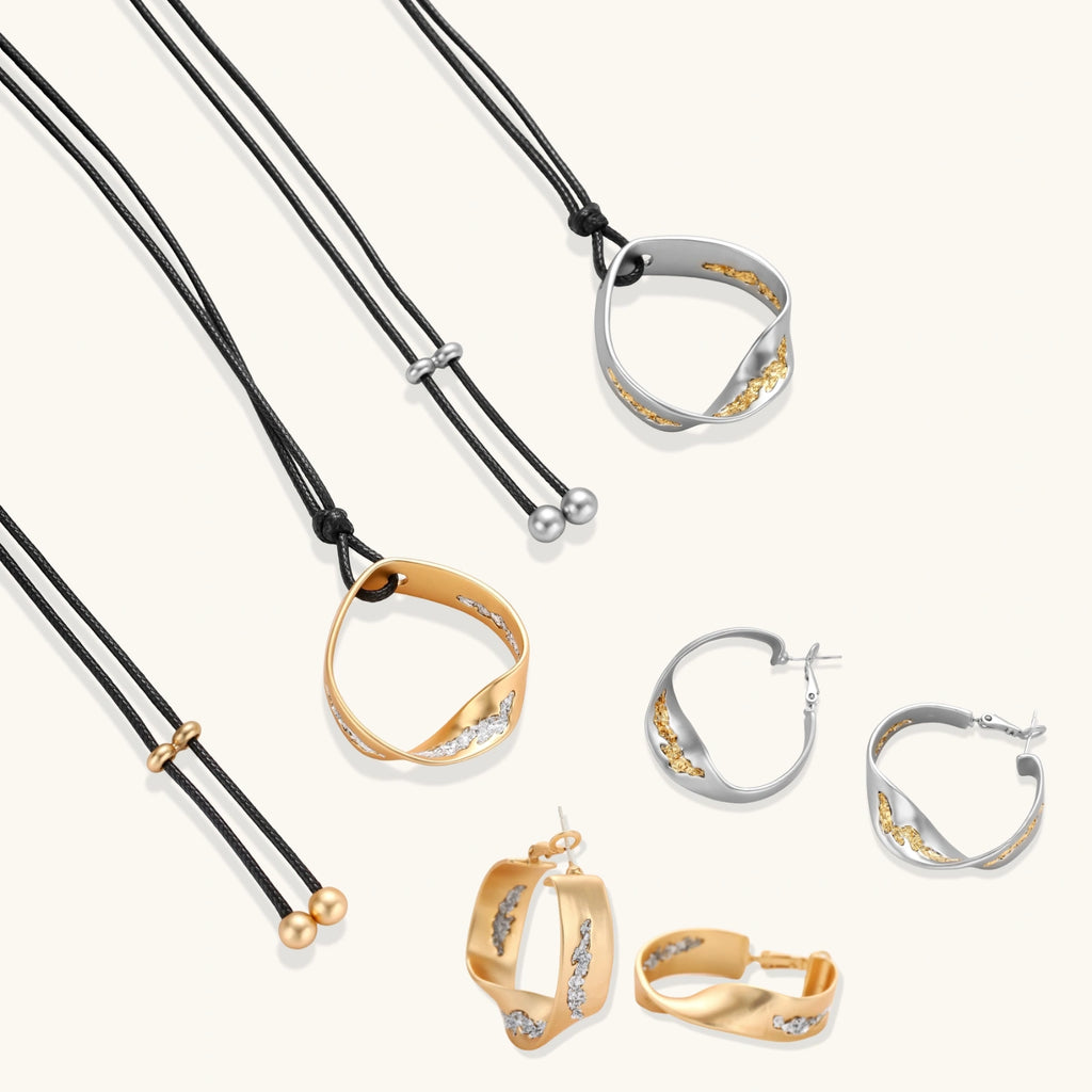 Gold circular pendant necklace with crystals on black cord paired with matching geometric hoop earrings on white background.